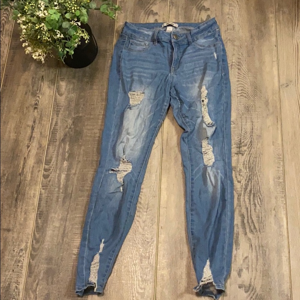 Blue distressed skinny jeans